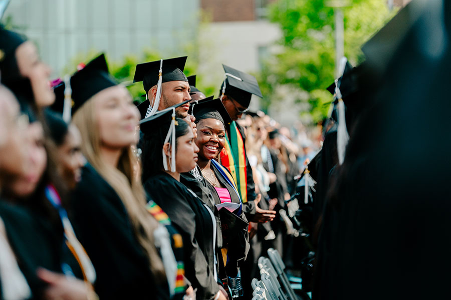 Undergrads smiling at commencement