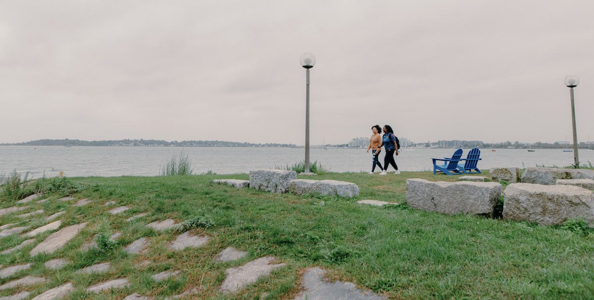 Students walking a long water