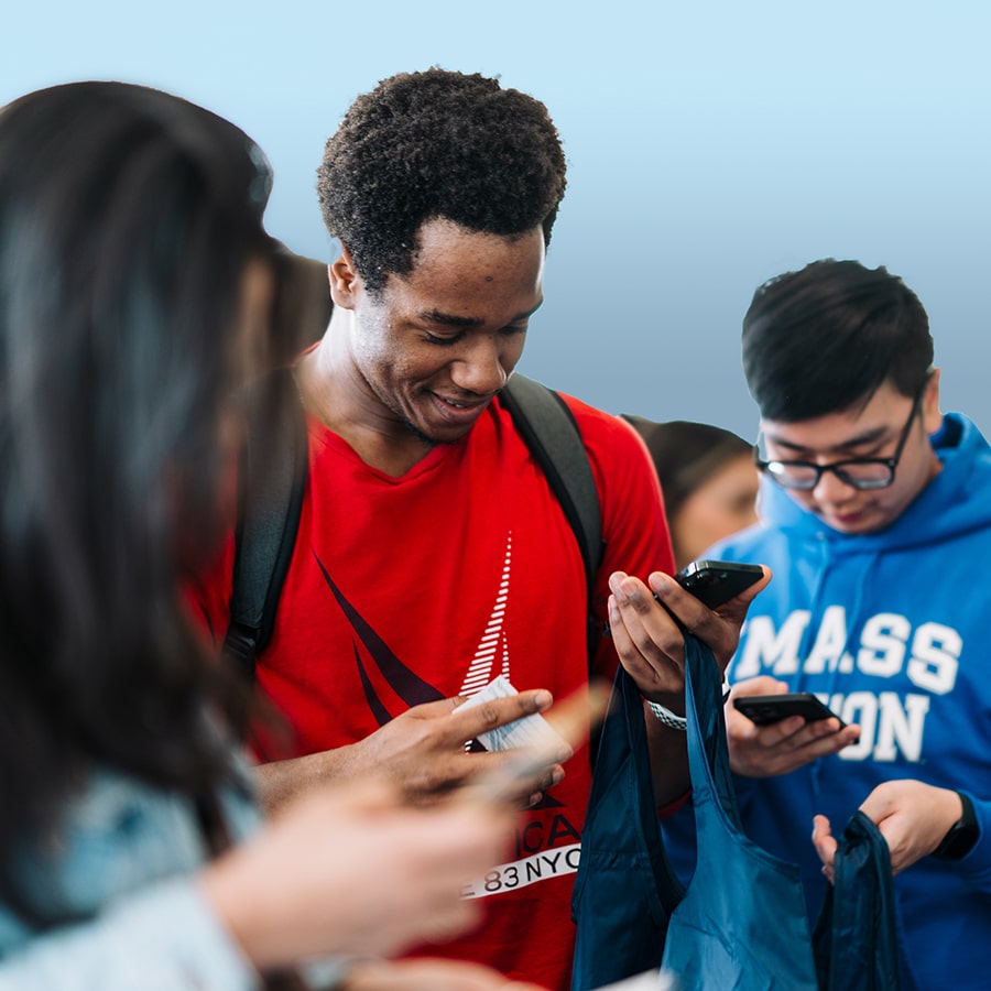 Students looking at phone 100 days to graduation