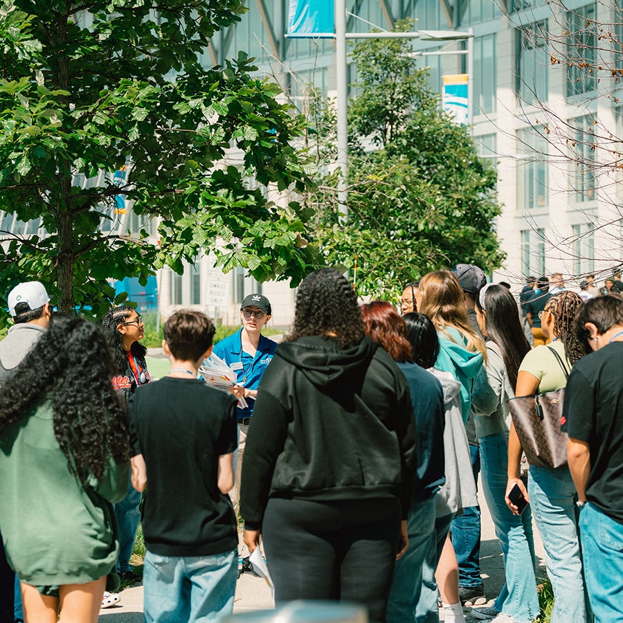 students outside with orientation guide at UMass Boston orientation 2023